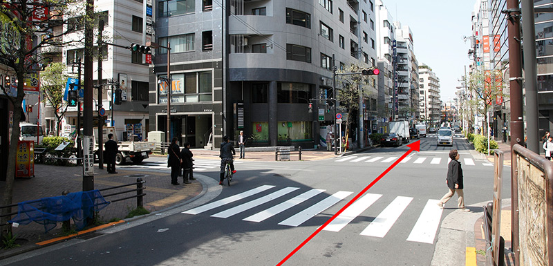 After crossing directly over the first intersection, you will see a Hosendo drug store on your left.