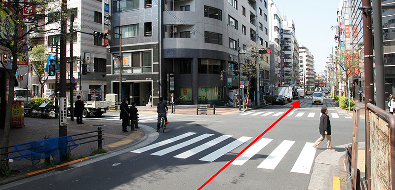 After crossing directly over the first intersection, you will see a Hosendo drug store on your left.